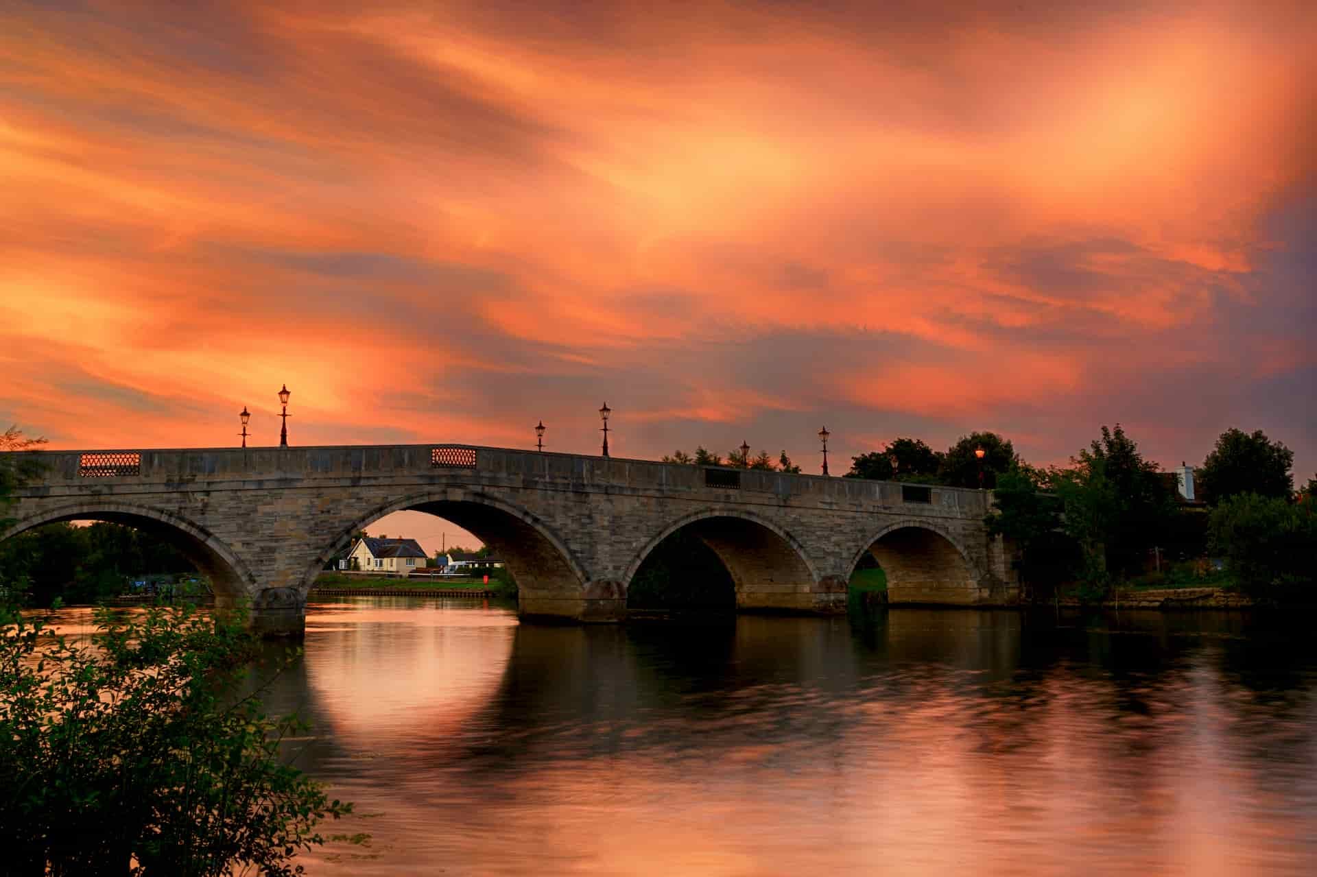 Colorful sky at sunset over Chertsey Bridge, Surrey, UK